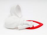a white vase with a red handle on a white surface