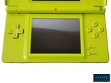 a green nintendo ds game console with a black screen