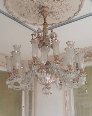 a chandelier that is hanging from the ceiling in a room