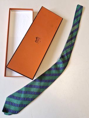 a tie that is laying on a table next to a box