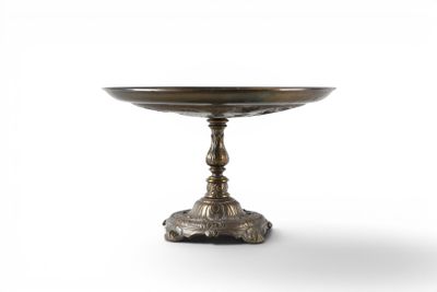 an image of a silver plate on a stand on a white background