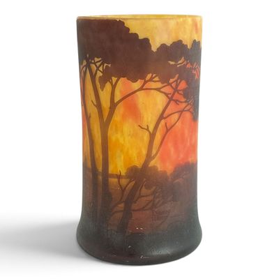 a vase that has a picture of a sunset on it