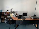 a desk with a keyboard and a monitor on it