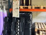 a large amount of bottles and pallets in a warehouse