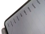 a close up of a cell phone with chinese writing on the screen