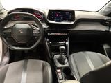 the interior of a car with a steering wheel and dashboard controls