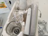 a white box with a sink and other items in it