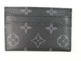 a close up of a black and white card case on a white surface
