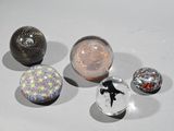 a lot of glass marbles sitting on a table