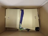 a cardboard box with a bunch of items inside of it