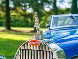 a close up of a car with a hood ornament on it