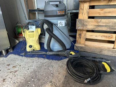 a vacuum and a hose on the floor next to a pallet