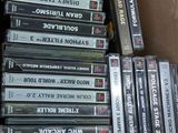 a lot of cassettes in a box on the floor