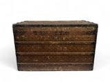 an old wooden chest with three drawers sitting on a white surface