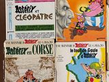 several children ' s books sitting on top of a table next to each other