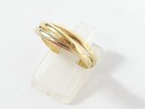 an image of a gold ring on a clear piece of plastic