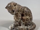 ceramic figurine of a leopard sitting on its hind legs