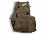 brown cordurope pants on a white background with a tag in the pocket
