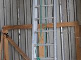 several pieces of wood are stacked on top of each other in a building