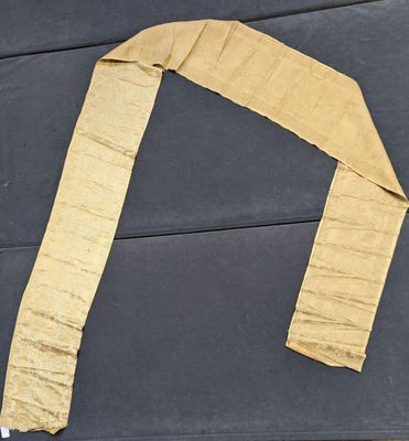 a piece of cloth that has been cut into pieces