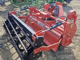 a close up of a tractor with a plow attached to it ' s back