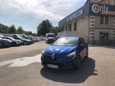 a blue car that is parked in front of a building