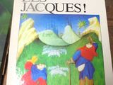 un livre sur les Jacquess posé sur une table, avec un stylo à côté