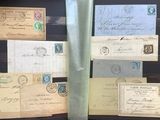 many old envelopes on display in a glass case