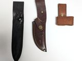 two leather sheaths and a leather knife on a white surface