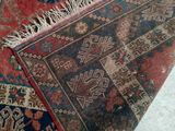 rugs and rugs are laid out on the floor in a room