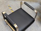 a black chair that is sitting on the ground
