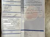 a close up of a receipt on a table with a barcode on it