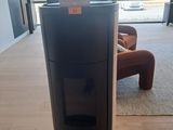 an image of a black stove in a living room