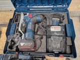 a blue tool case with tools in it on the floor