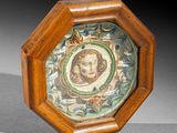 a wooden frame with a picture of a woman on it