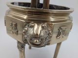 an antique silverplated incense box with lion head on top