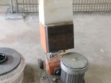 a machine that is sitting on the floor next to a fan
