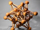 a wooden model of a star made of wooden balls