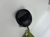 an image of a black air purifier mounted on a wall