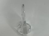 a clear glass candle holder on a white table
