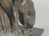 statue of a woman and a dog on a marble base