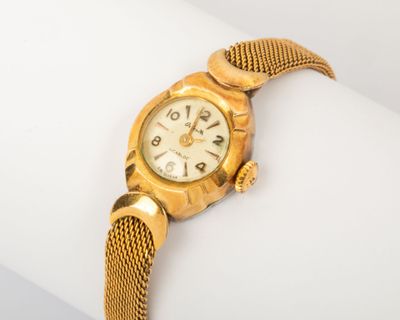 an image of a close up of a wrist watch on a white surface