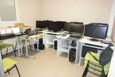 a room with a bunch of computers on the desk