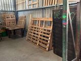 several pallets of wood are stacked up in a warehouse