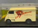 a toy truck in a clear box on a table