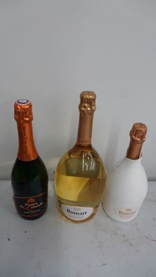 three bottles of wine sitting next to each other on a table