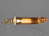 a close up of a gold plated metal object on a table