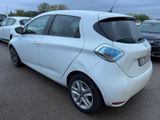 a picture of a white car parked in a parking lot