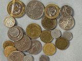 a lot of coins that are on the table