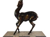 an image of a bronze statue of a deer on a marble base